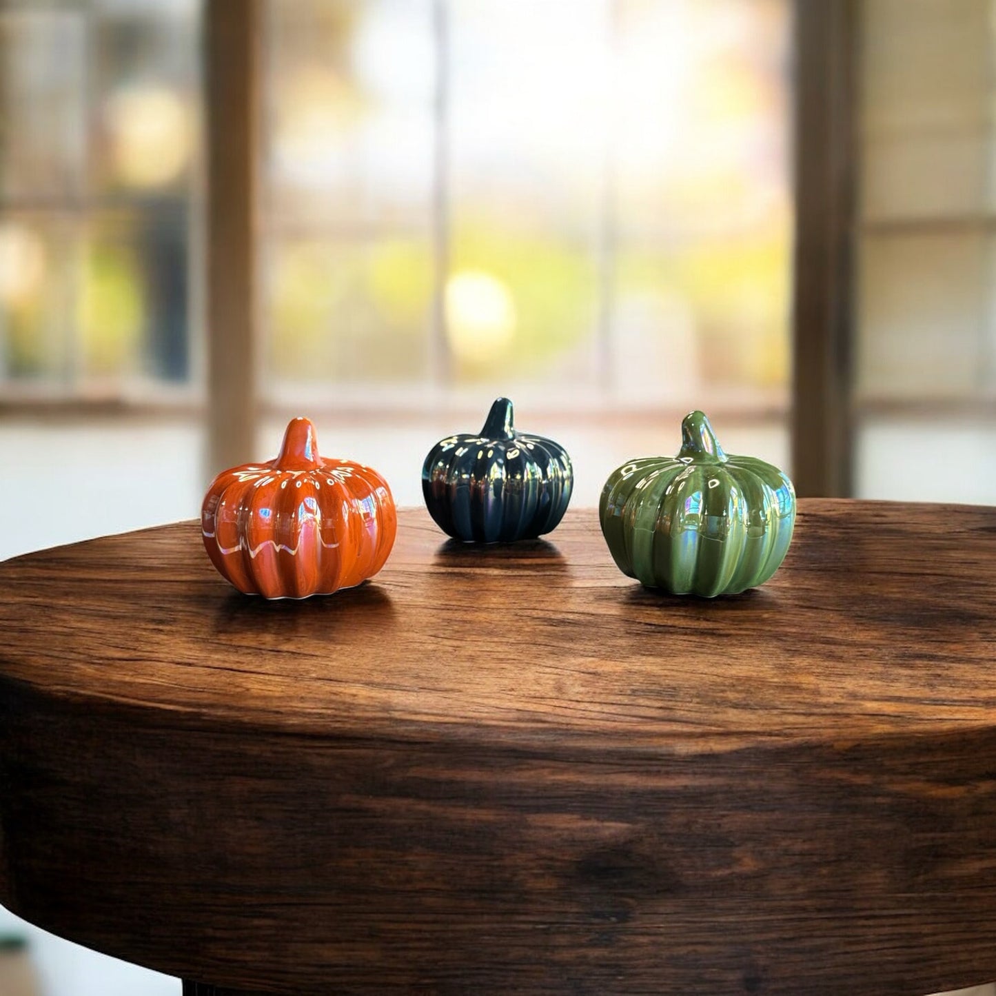 Three ceramic fall pumpkins.